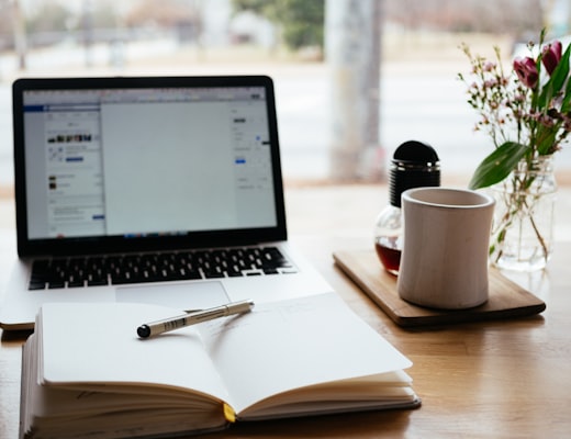 Minimal work desk with laptop and coffee