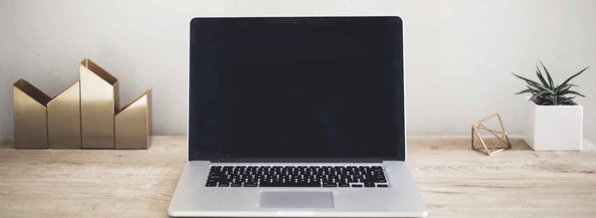 Laptop screen with code in a dark room
